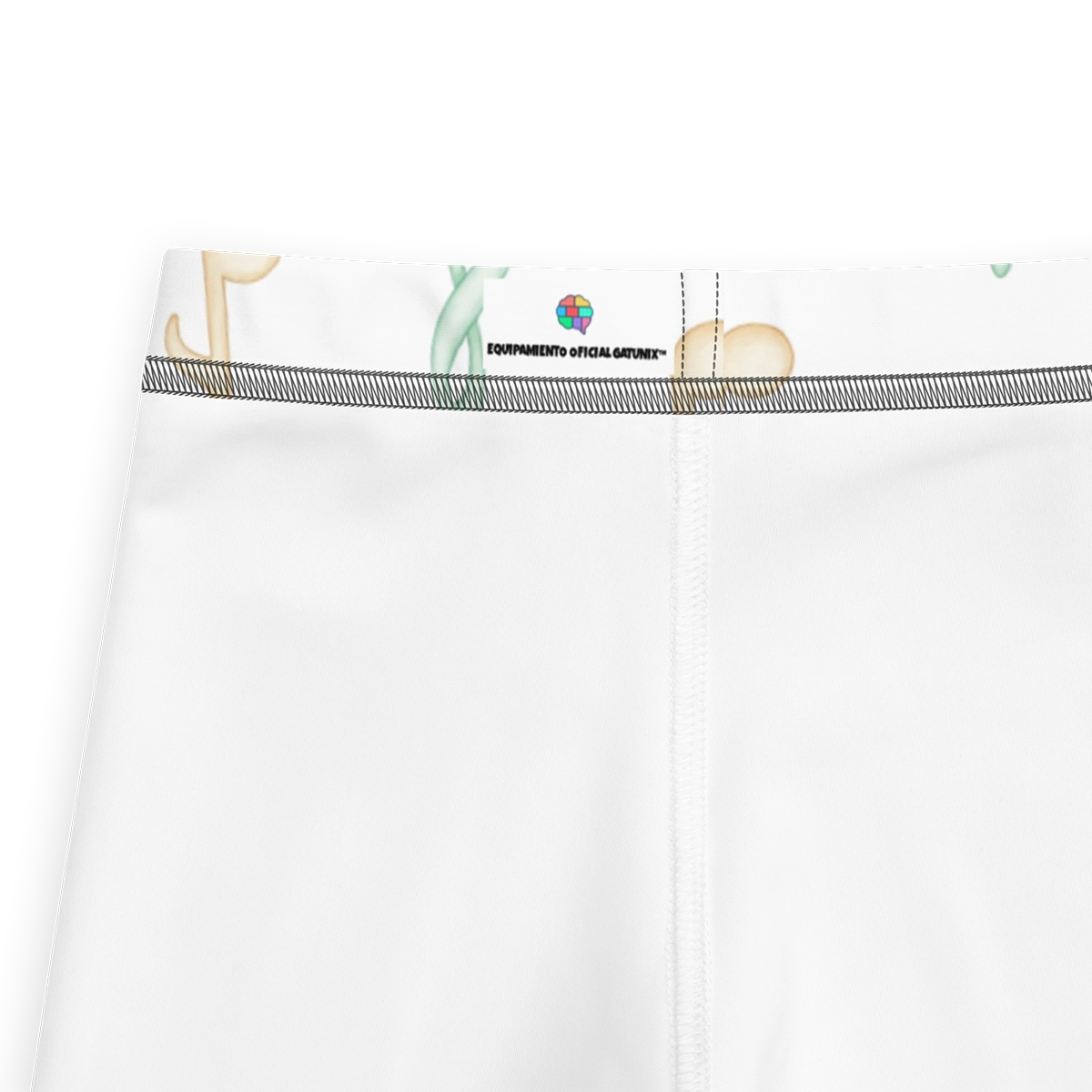 Detalle de la etiqueta interior de los leggings Gatunix con el logotipo del cerebro y el texto Equipamiento Oficial Gatunix™ sobre fondo blanco