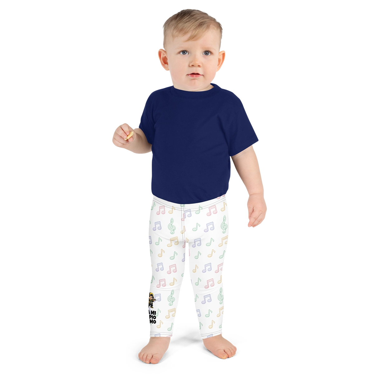 Bebé con los leggings oficiales de Nota Loca del método Gatunix, mostrando el patrón de notas musicales de colores sobre fondo blanco